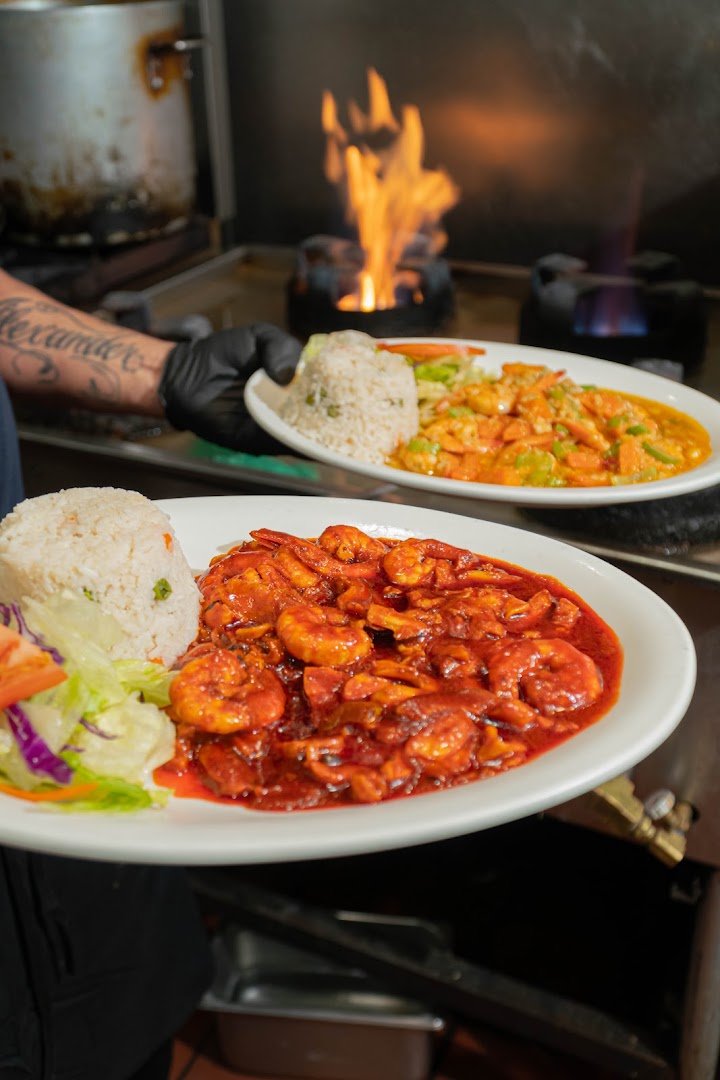 Seafood dishes served with lime and fresh garnishes.