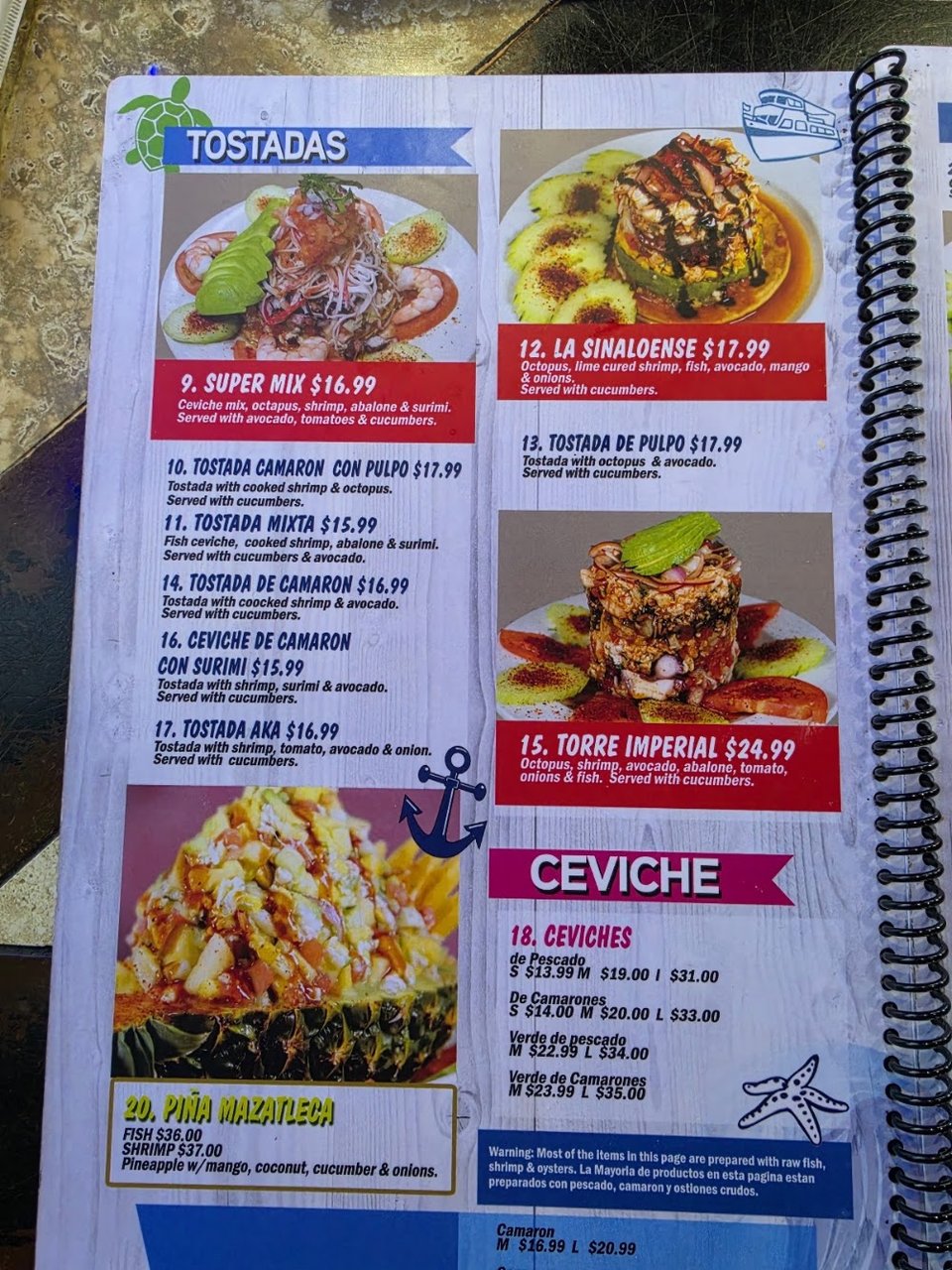 Printed menu pages with fajitas and ceviche sections.