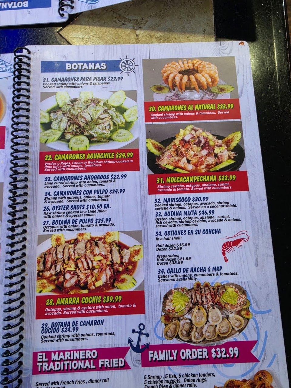 Menu layout showing seafood plates and salads.